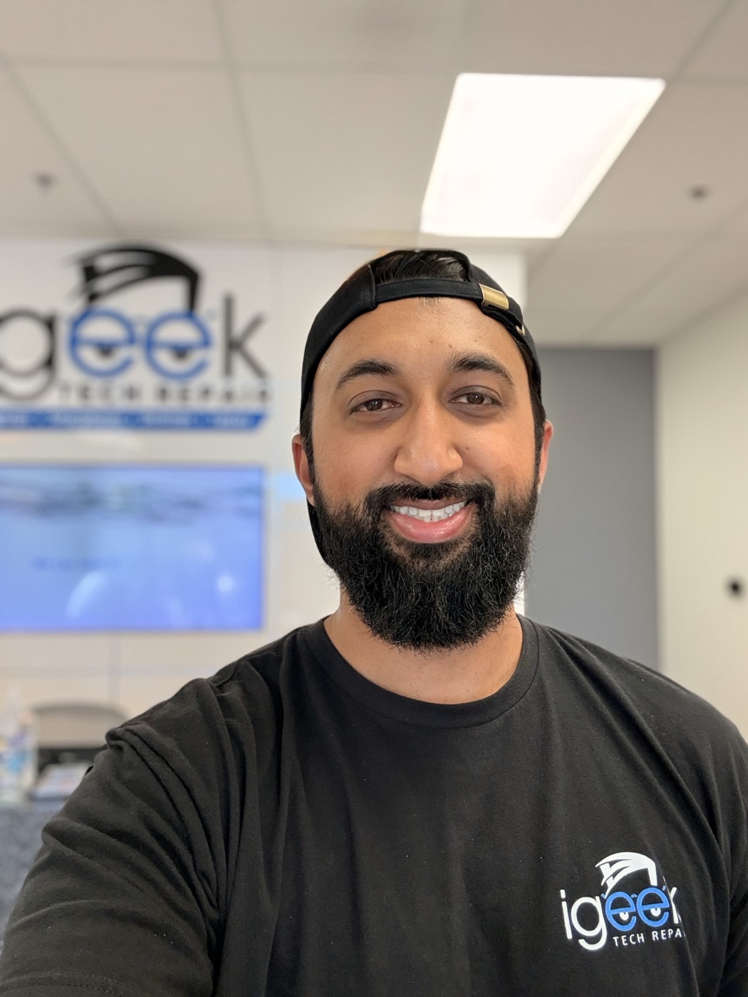 Hammad, founder of iGeek Tech Repair, inside the Elk Grove shop